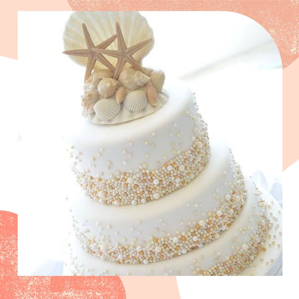 topo de bolo de casamento estrela e concha do mar